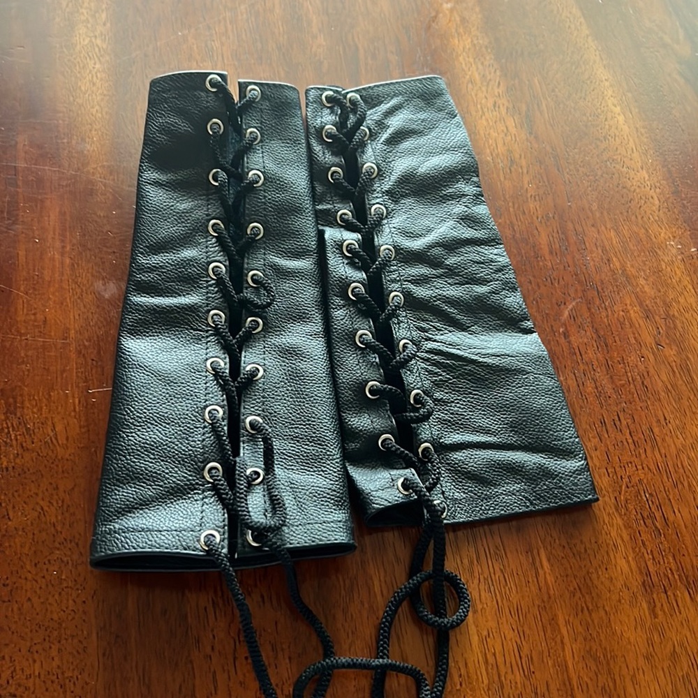 Leather lace up gloves.
